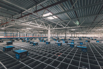 Autostore-System mit mehreren Robotern in einem Arvato-Lager